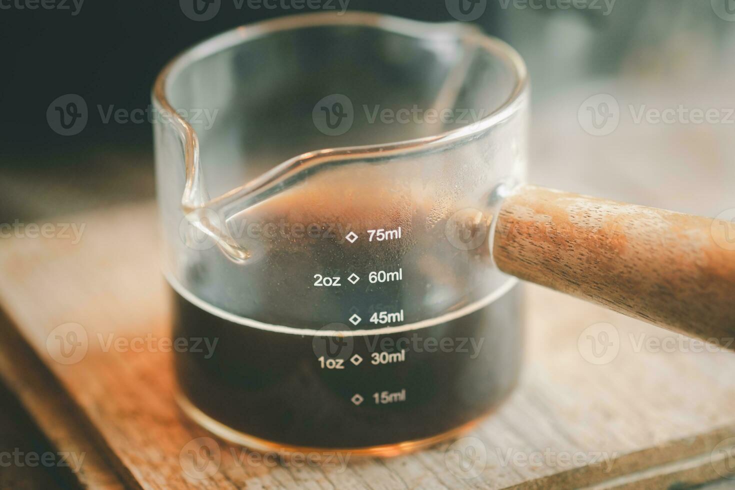 Shot of espresso. Process of making coffee photo