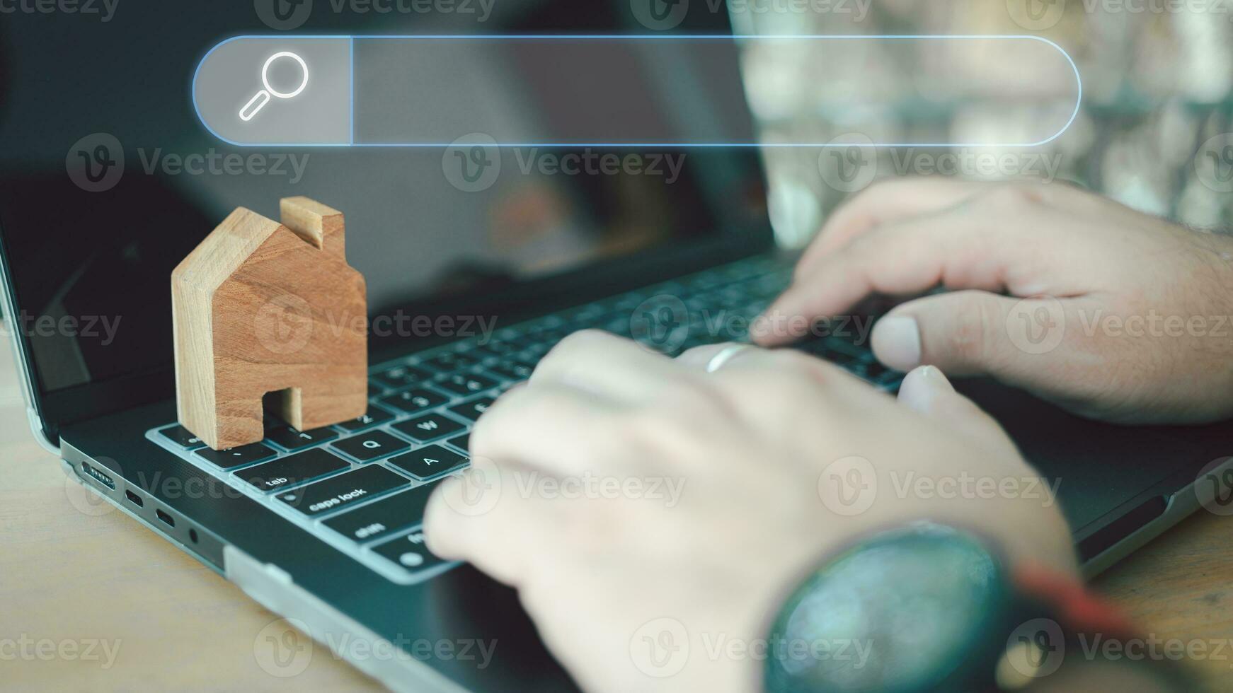 Men use computer laptop to find what they are interested about real estate. photo