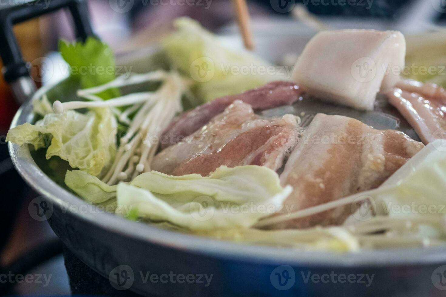 Grilled raw pork on the stove. Thai food buffet photo