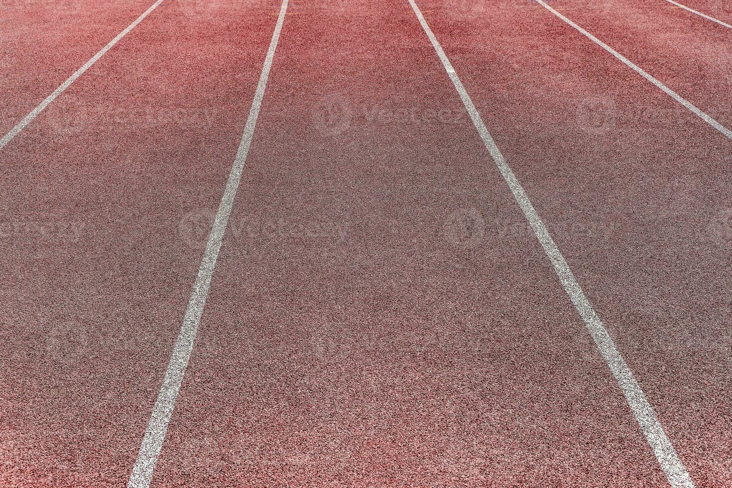 Sports surface, stadium running track. Background for motivation, striving forward. Copyspace photo