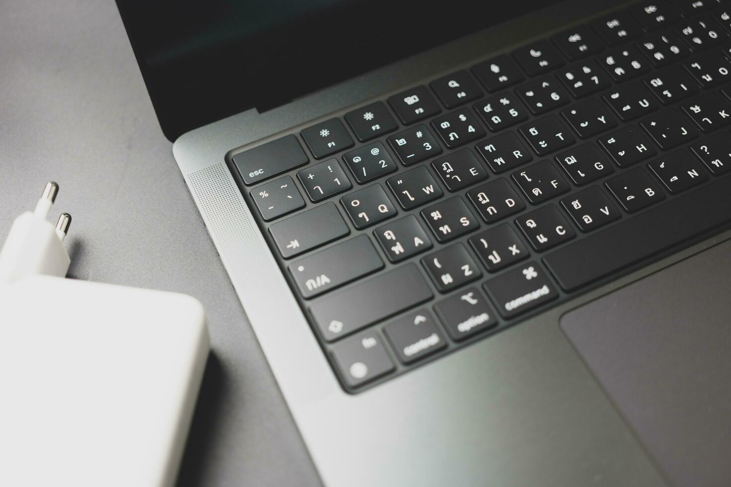 Bangkok, Thailand - December 27, 2023 Close up of a Thai language keyboard of Apple MacBook Pro M3 Max photo