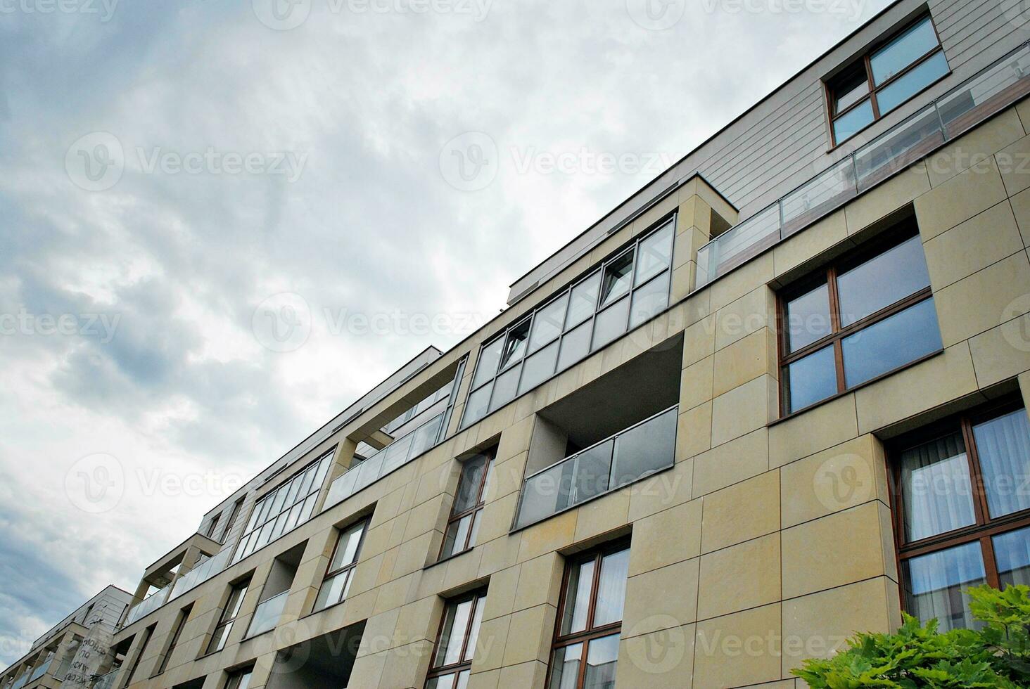 Modern and new apartment building. Multistoried, modern, new and stylish living block of flats. photo