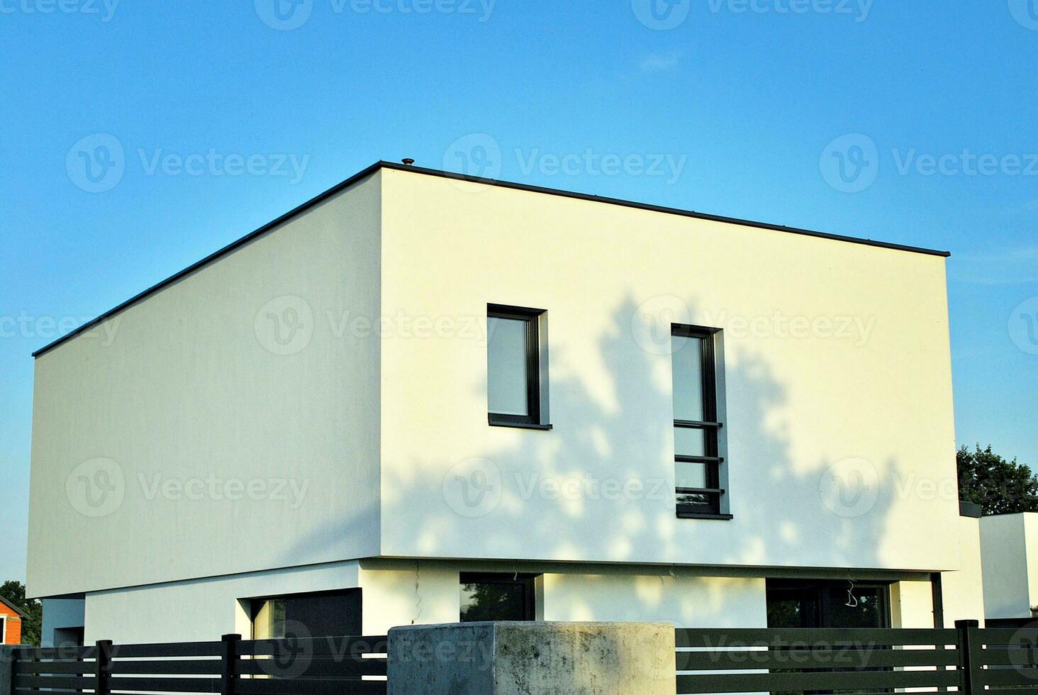 Perfectly manicured suburban house on a beautiful sunny day photo