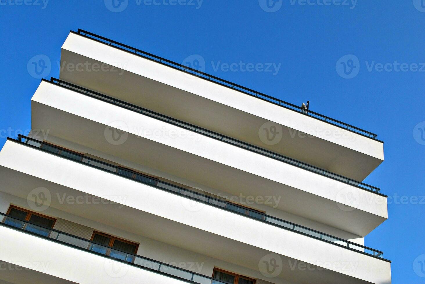 Modern and new apartment building. Multistoried, modern, new and stylish living block of flats. photo