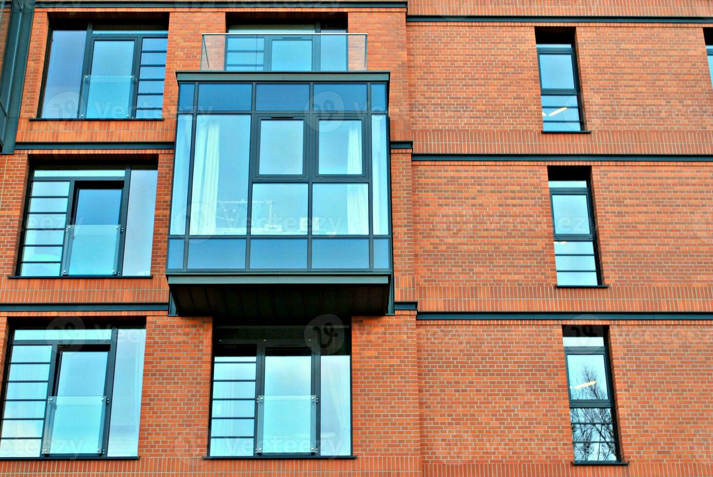 Modern and new apartment building. Multistoried, modern, new and stylish living block of flats. photo