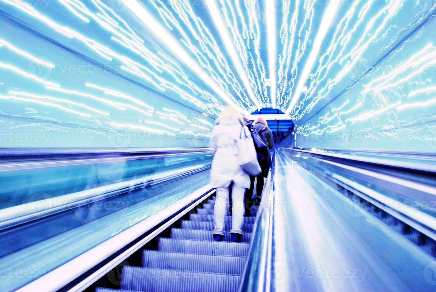 Blurred backround of moving futuristic escalator. Blurred image.Post process in vintage style photo