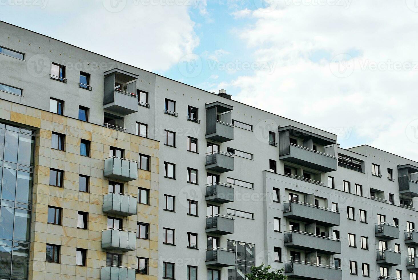 Modern and new apartment building. Multistoried, modern, new and stylish living block of flats. photo