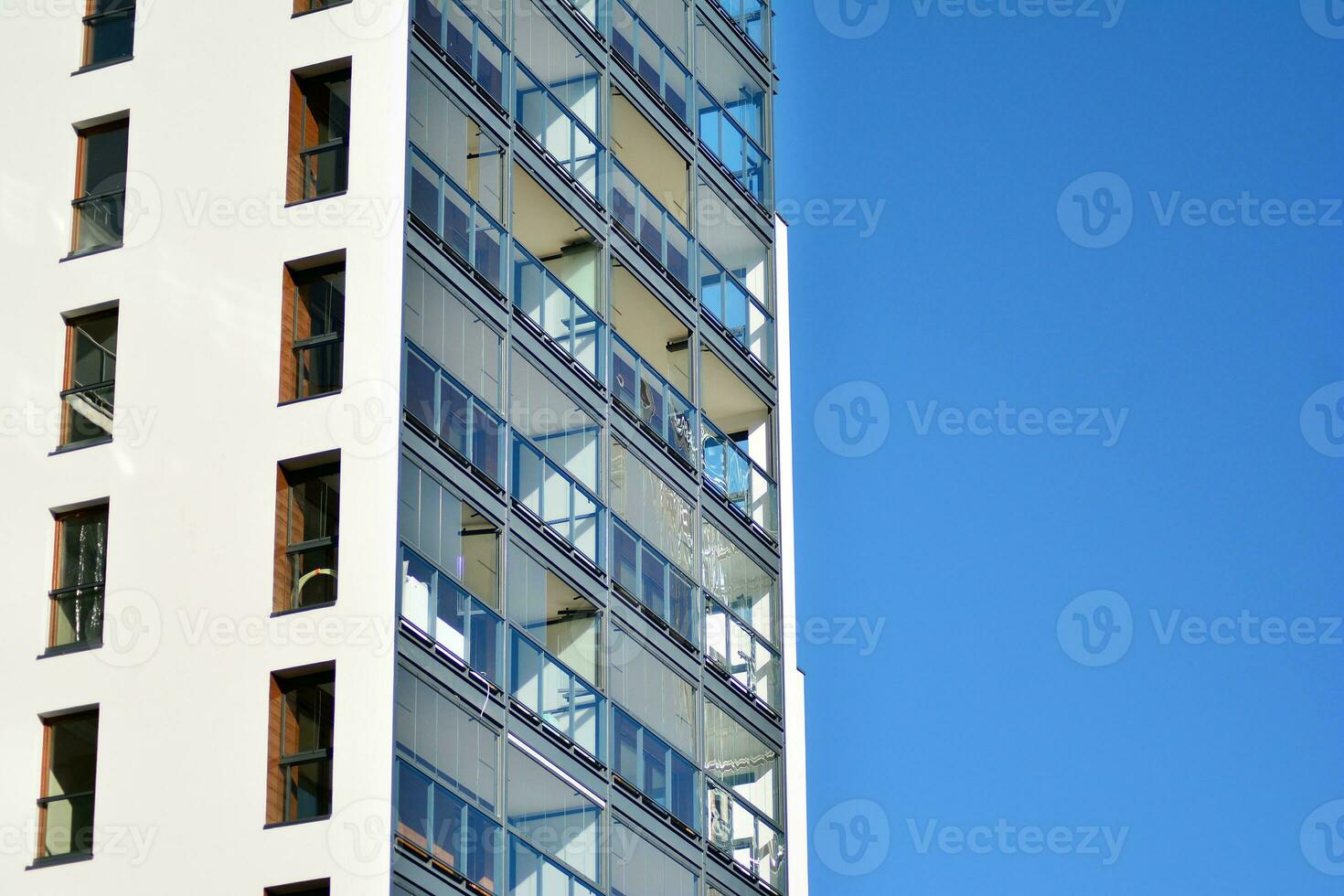 Modern and new apartment building. Multistoried, modern, new and stylish living block of flats. photo