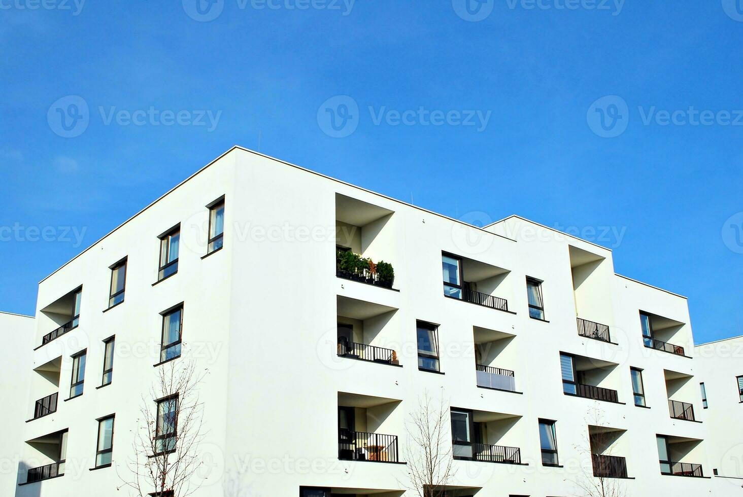 Modern and new apartment building. Multistoried, modern, new and stylish living block of flats. photo
