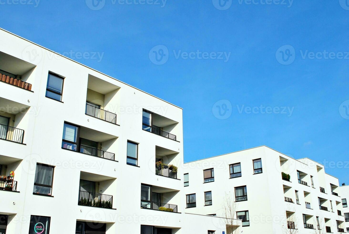 Modern and new apartment building. Multistoried, modern, new and stylish living block of flats. photo