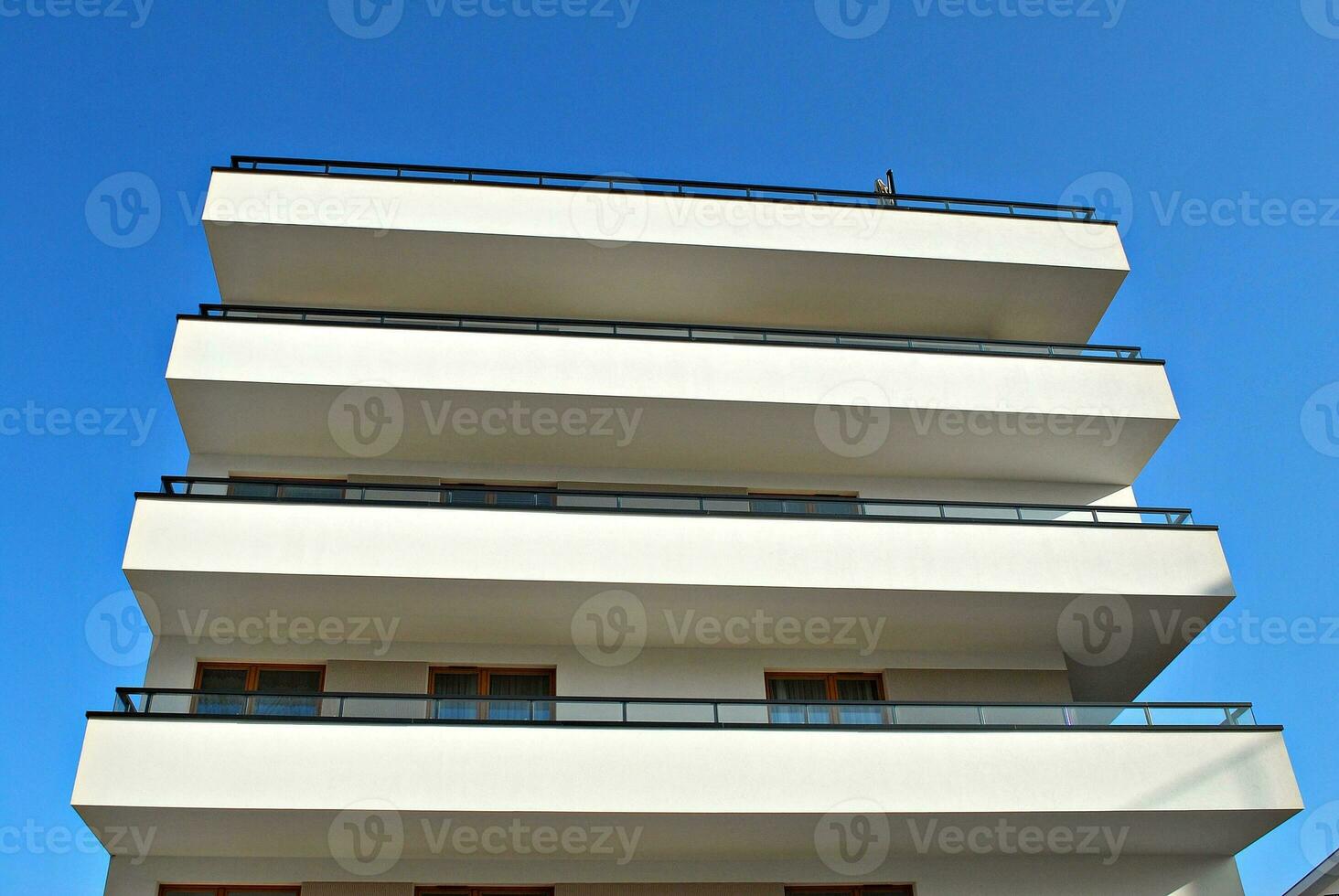 Modern and new apartment building. Multistoried, modern, new and stylish living block of flats. photo