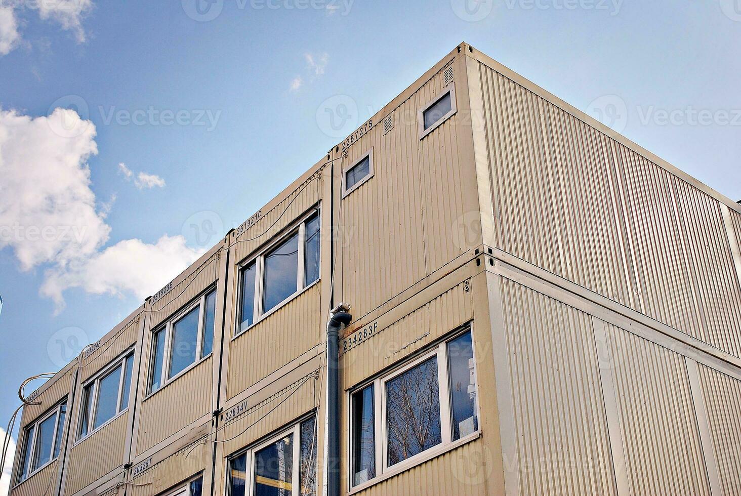 Modern and new apartment building. Multistoried, modern, new and stylish living block of flats. photo