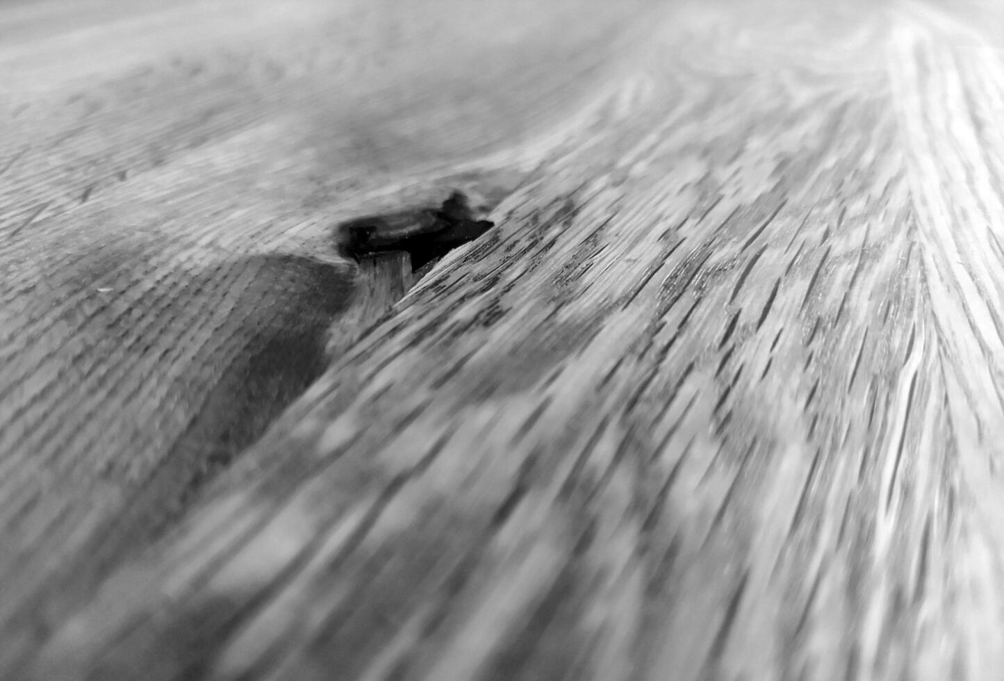 Natural wood black and white background with blurred elements. Monochrome wooden surface pattern, grayscale wood texture photo