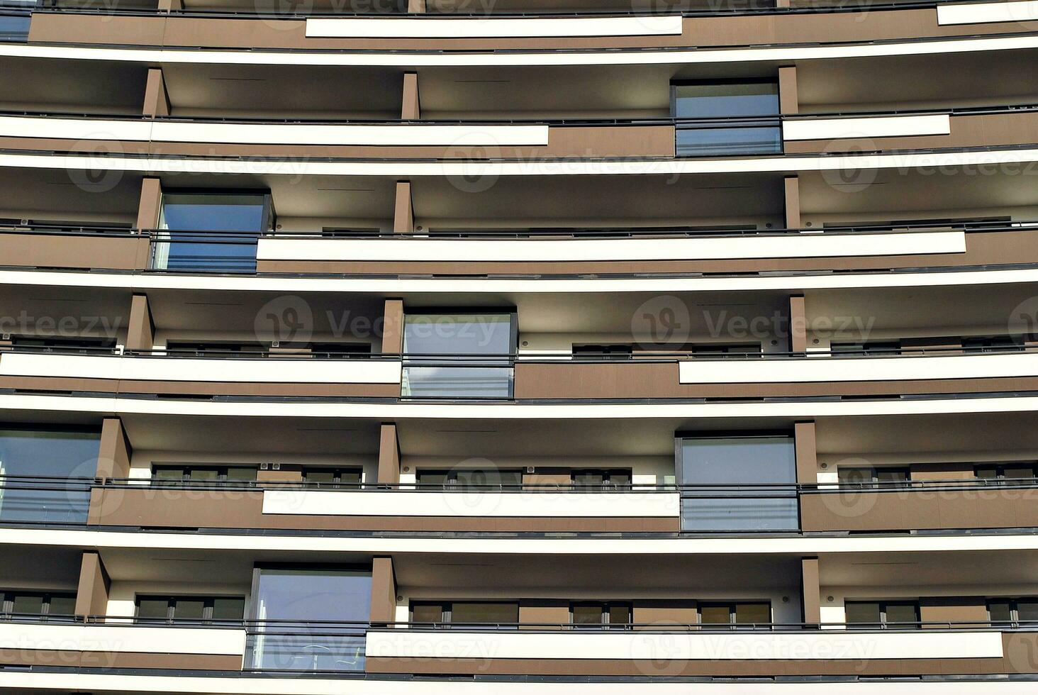 Modern and new apartment building. Multistoried, modern, new and stylish living block of flats. photo