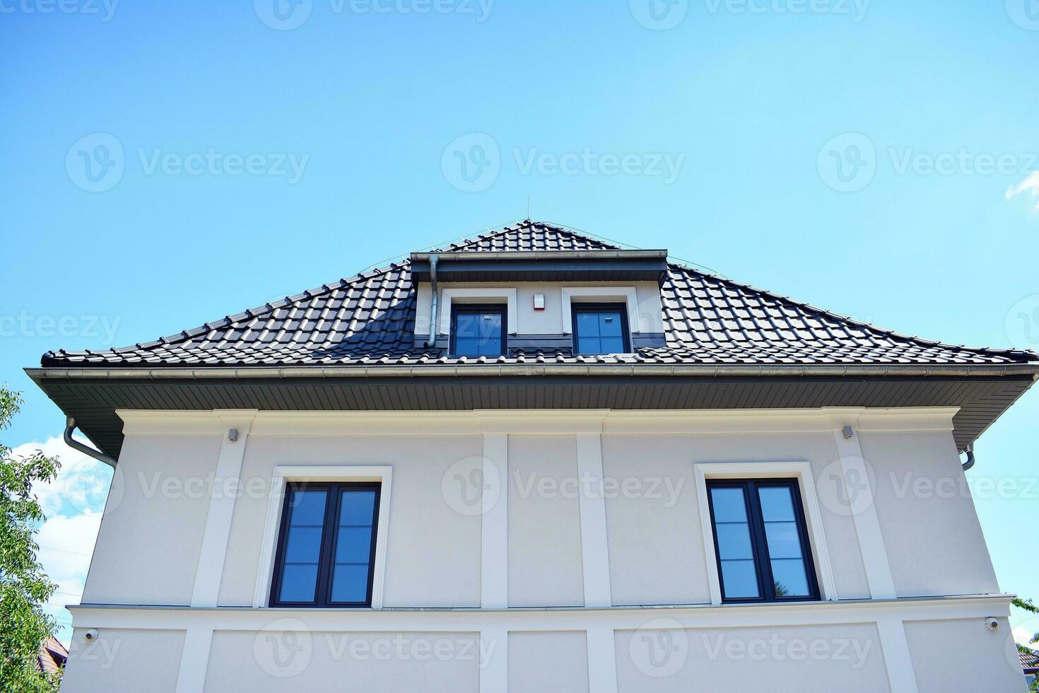 Perfectly manicured suburban house on a beautiful sunny day photo