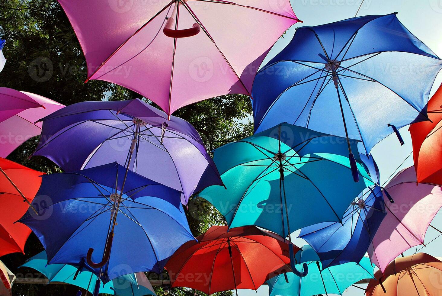 Colorful umbrellas background. Colorful umbrellas in the sky. Street decoration. photo