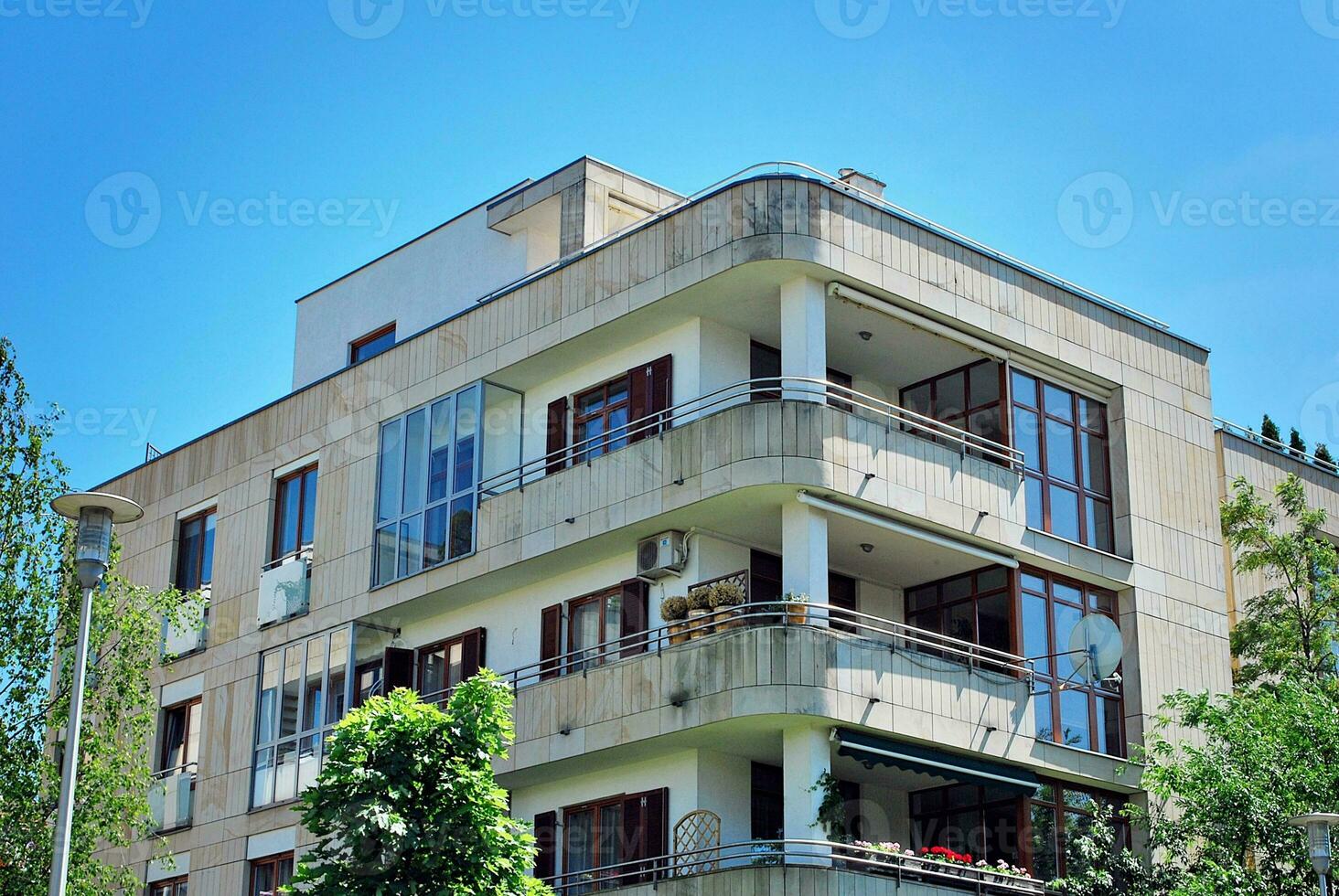 Modern and new apartment building. Multistoried, modern, new and stylish living block of flats. photo