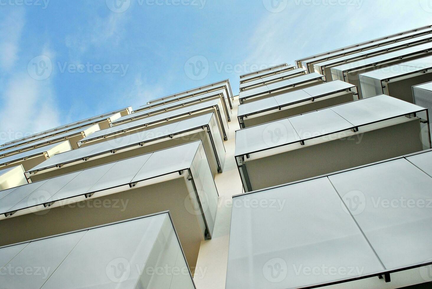 Modern and new apartment building. Multistoried, modern, new and stylish living block of flats. photo