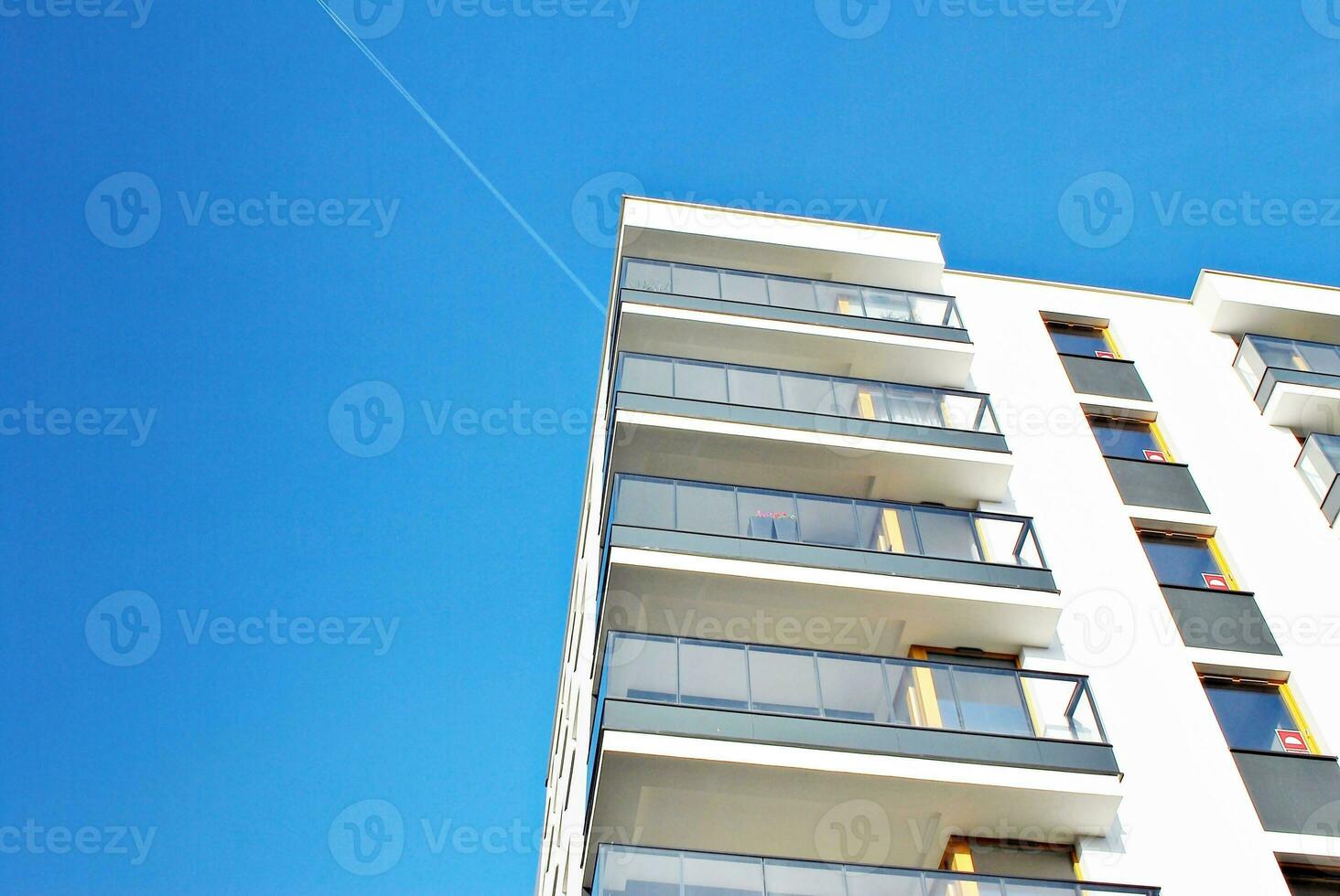 Modern and new apartment building. Multistoried, modern, new and stylish living block of flats. photo