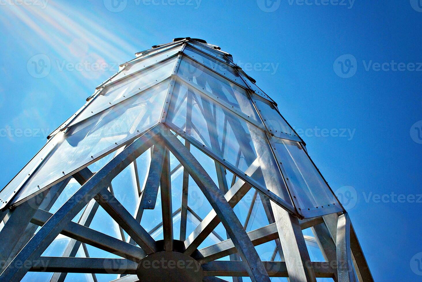 Modern building glass roof metal frame construction. Metal structure supporting glass roof. photo