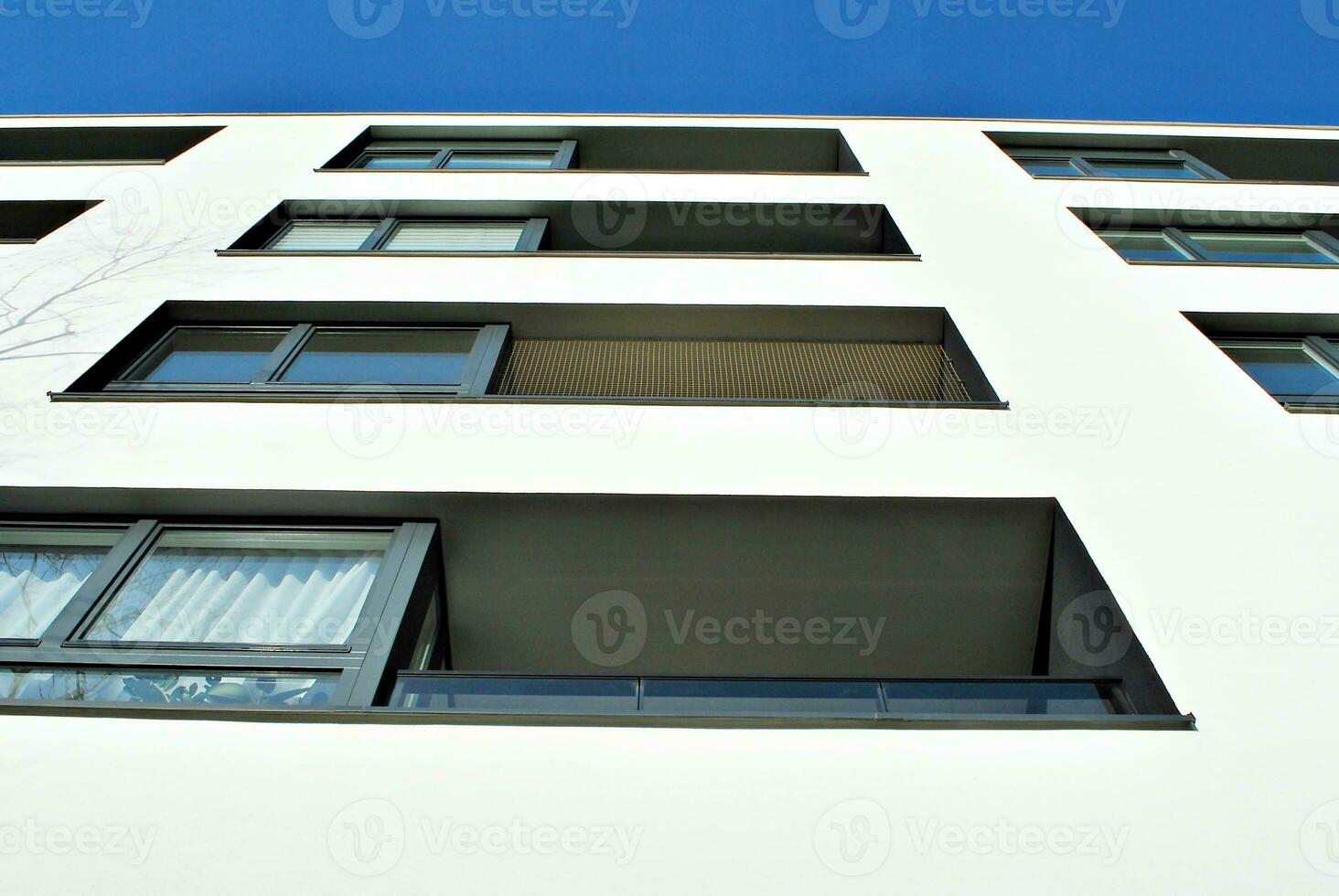 Modern and new apartment building. Multistoried, modern, new and stylish living block of flats. photo