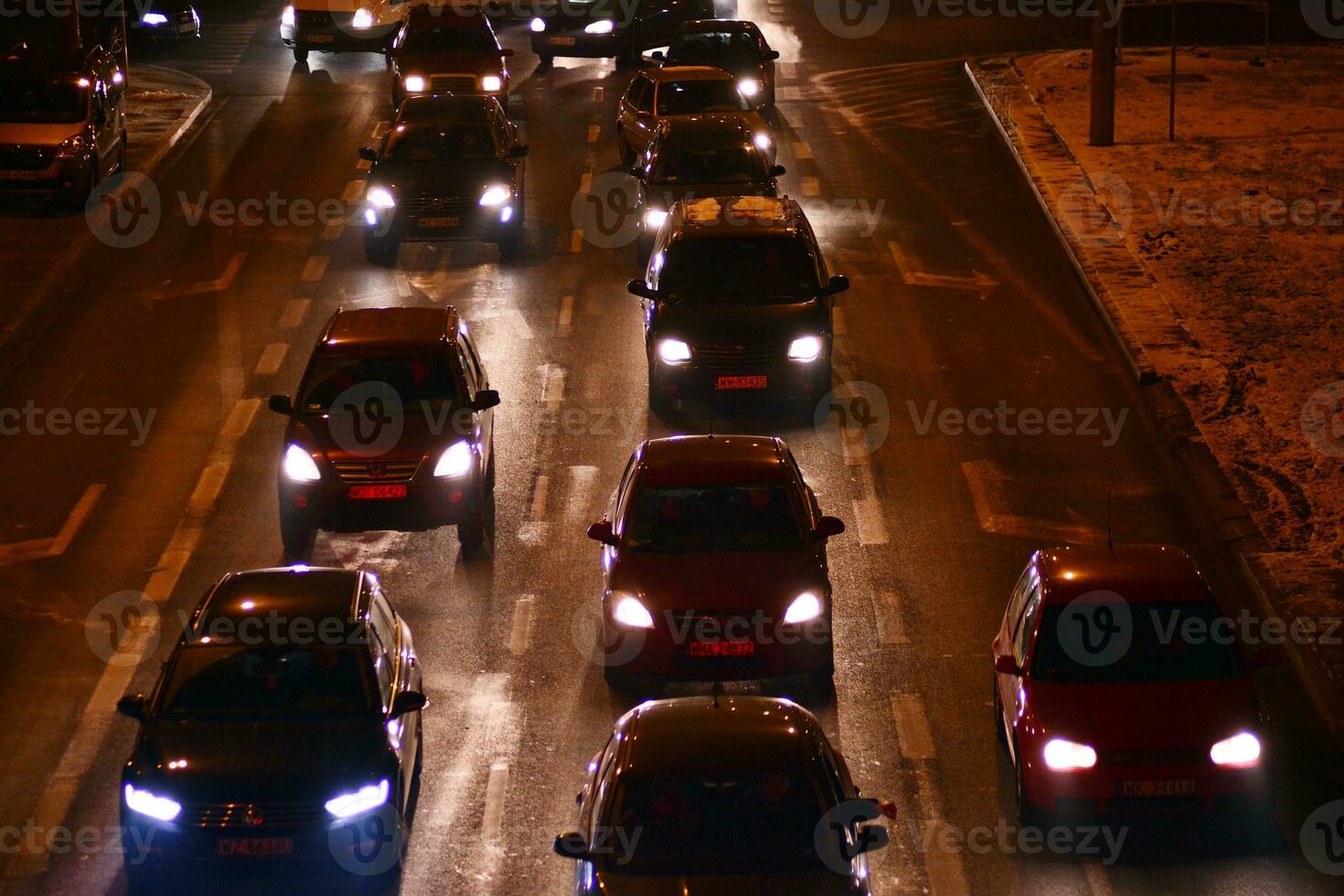 Cars on street. City street lights at night. photo
