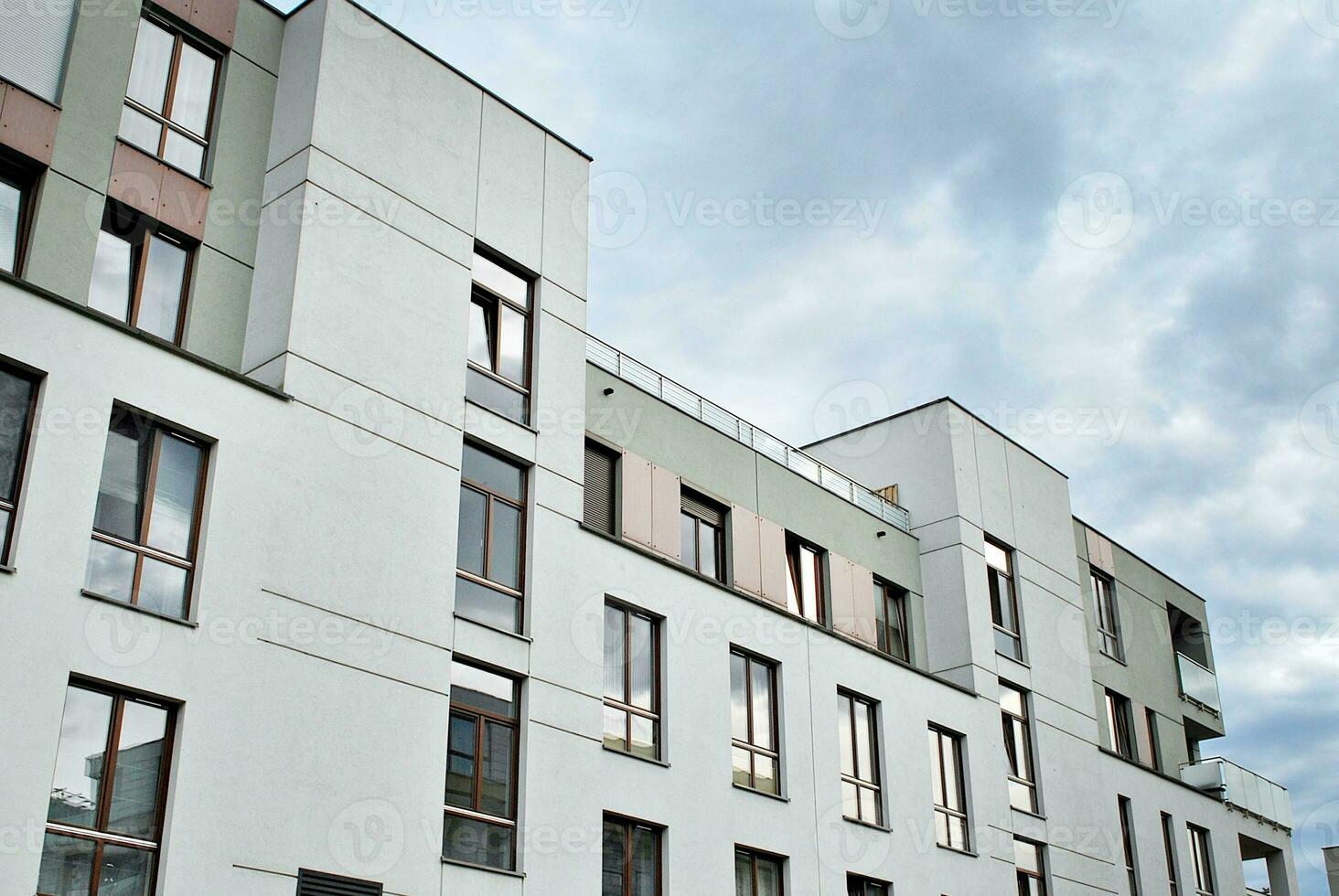 Modern and new apartment building. Multistoried, modern, new and stylish living block of flats. photo