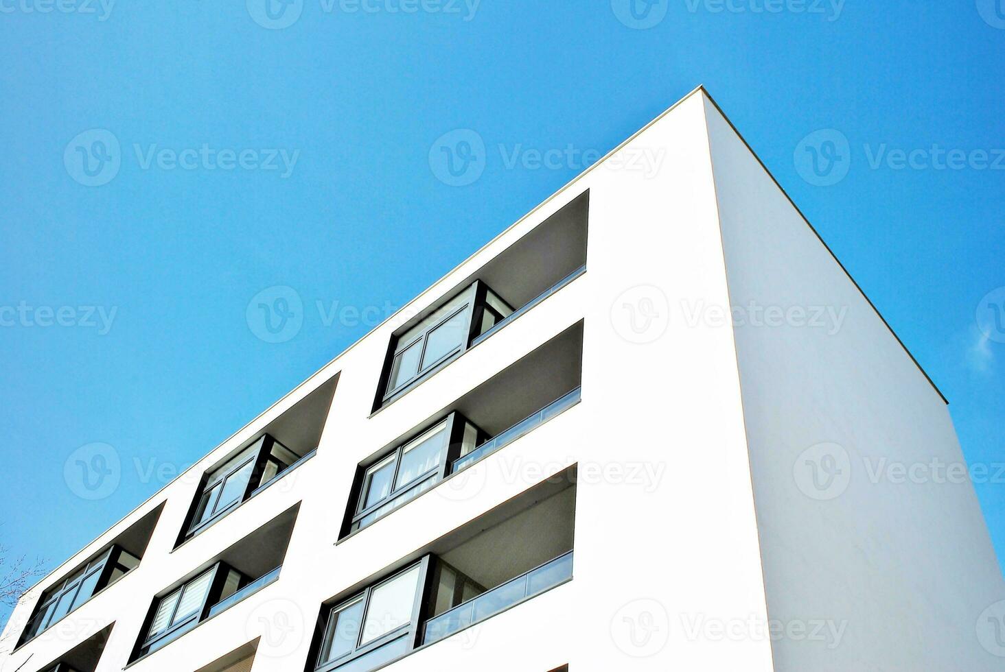 Modern and new apartment building. Multistoried, modern, new and stylish living block of flats. photo