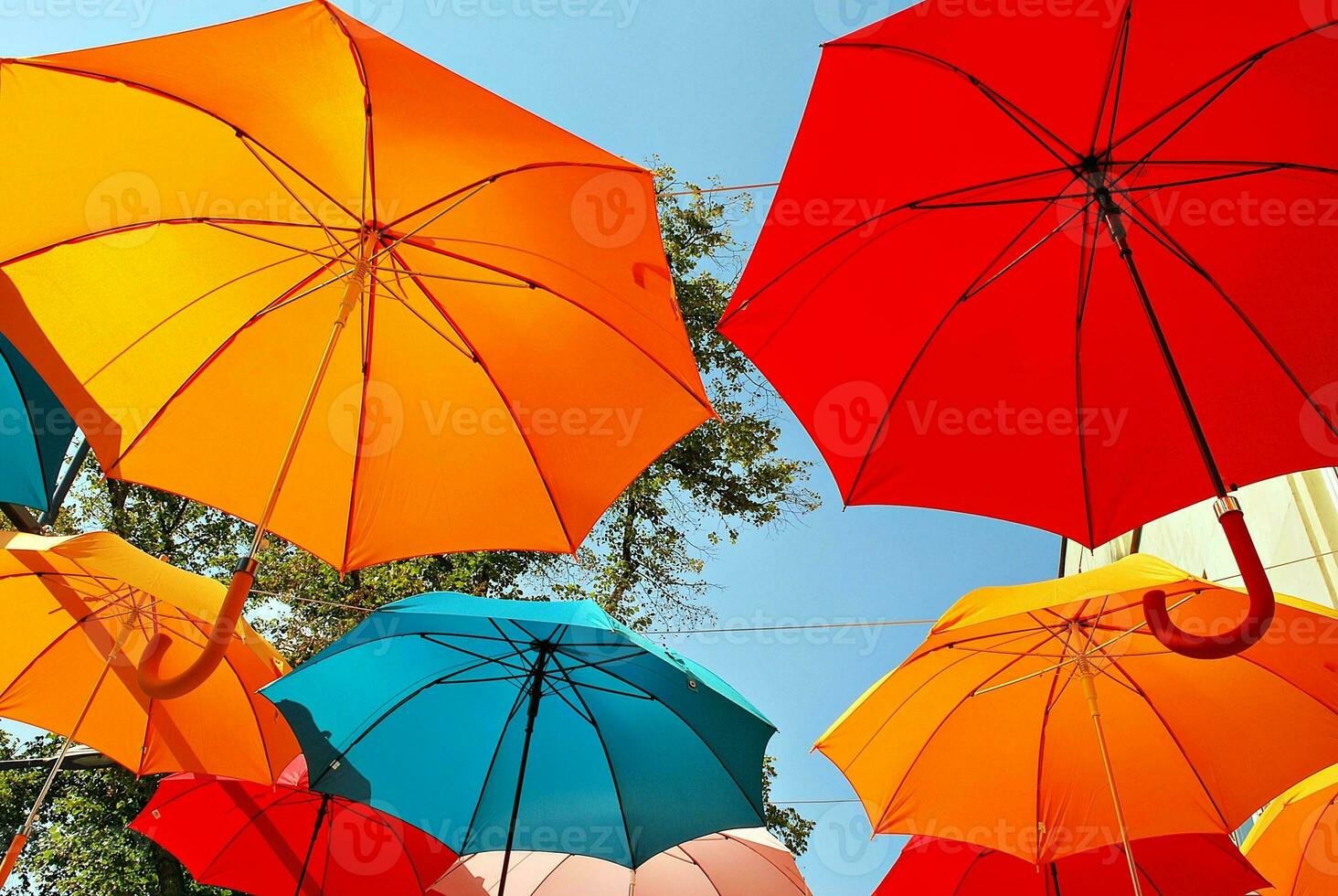 Colorful umbrellas background. Colorful umbrellas in the sky. Street decoration. photo