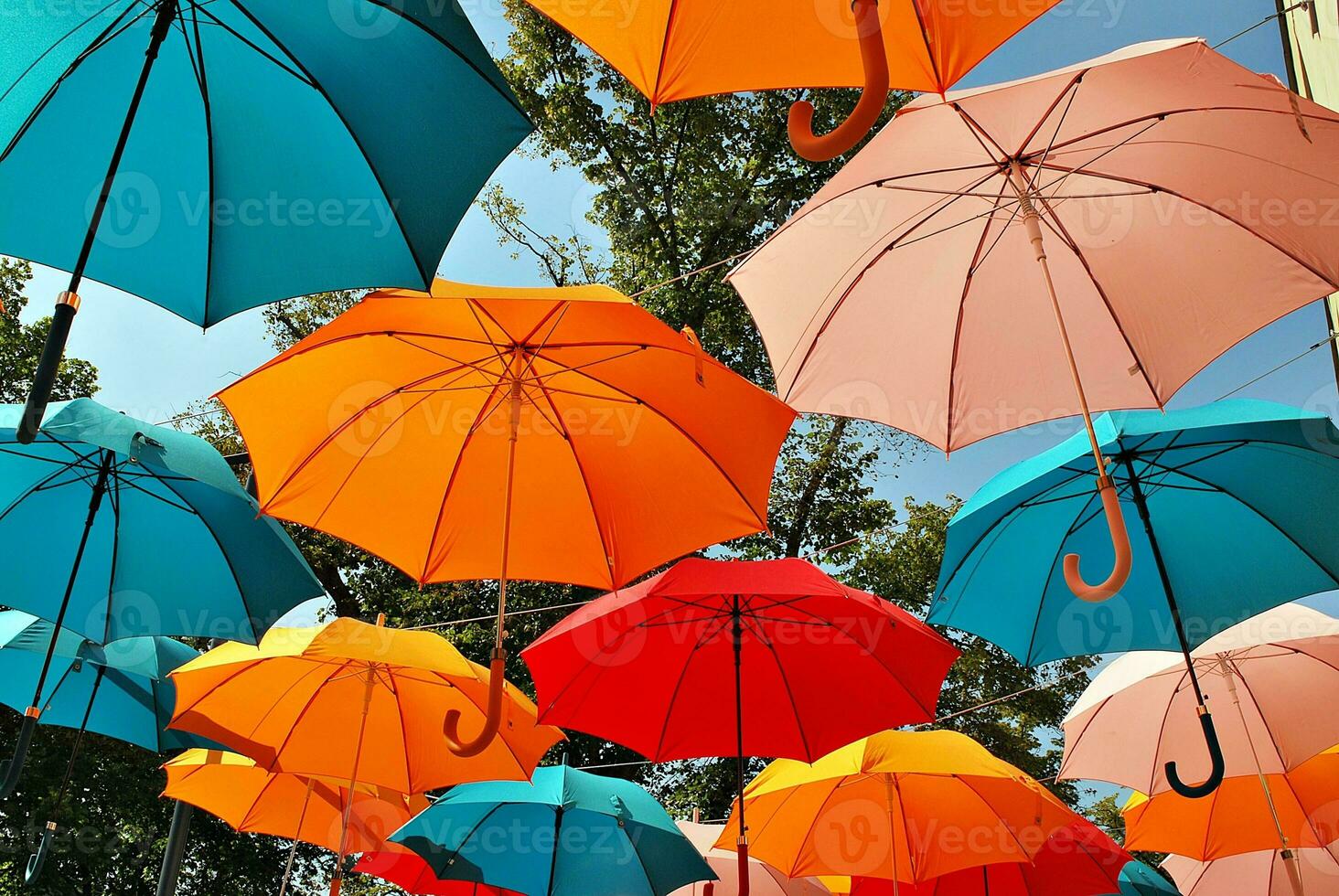 Colorful umbrellas background. Colorful umbrellas in the sky. Street decoration. photo
