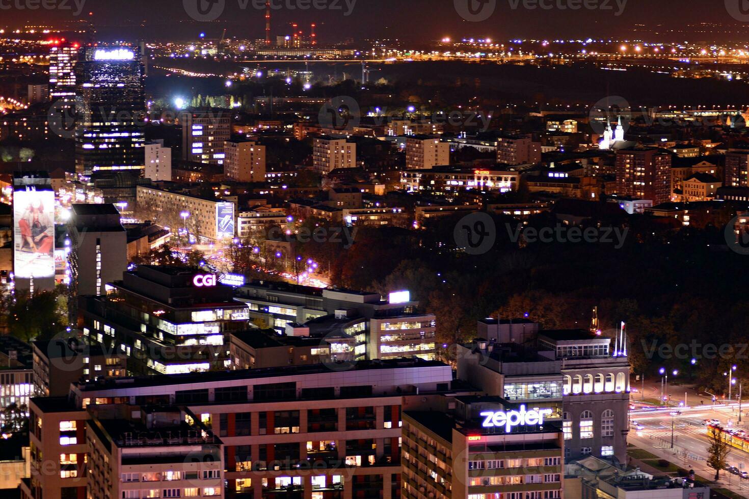 View of at night glass buildings and modern business skyscrapers. View of modern skyscrapers and  business buildings in downtown. Big city at night. photo
