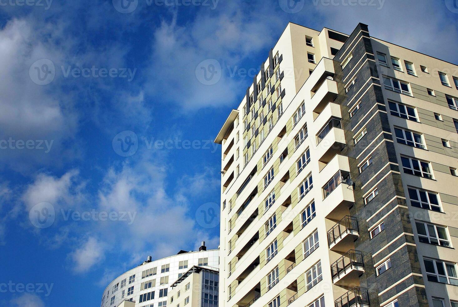 Modern and new apartment building. Multistoried, modern, new and stylish living block of flats. photo