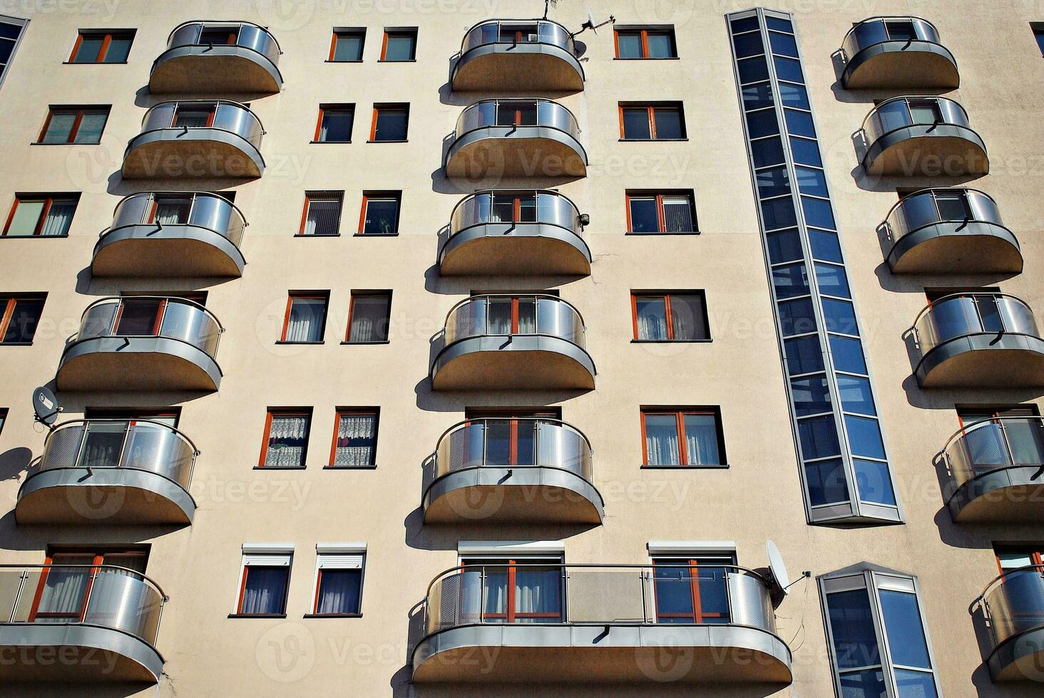 Modern and new apartment building. Multistoried, modern, new and stylish living block of flats. photo