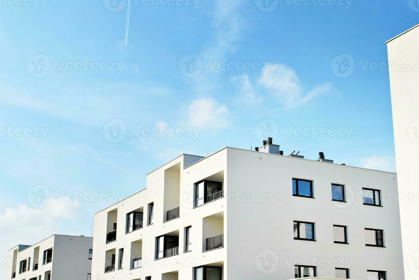 Modern and new apartment building. Multistoried, modern, new and stylish living block of flats. photo
