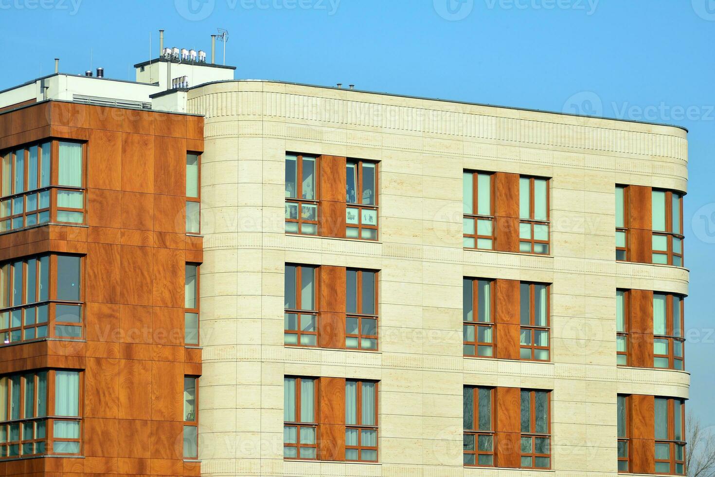 Modern and new apartment building. Multistoried, modern, new and stylish living block of flats. photo