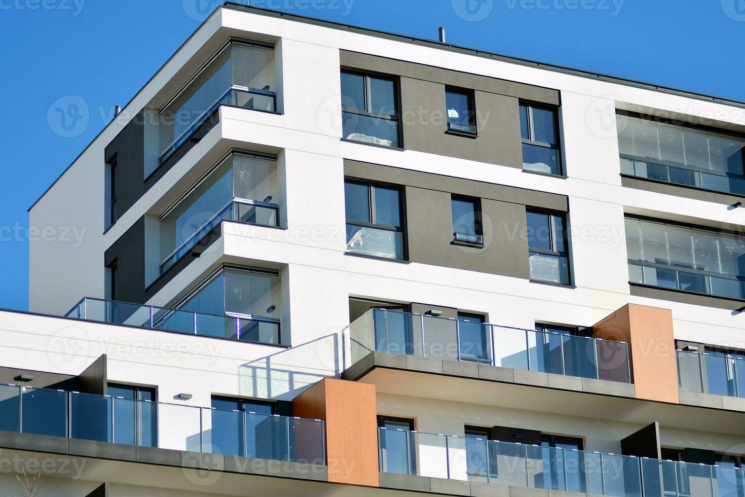 Modern and new apartment building. Multistoried, modern, new and stylish living block of flats. photo