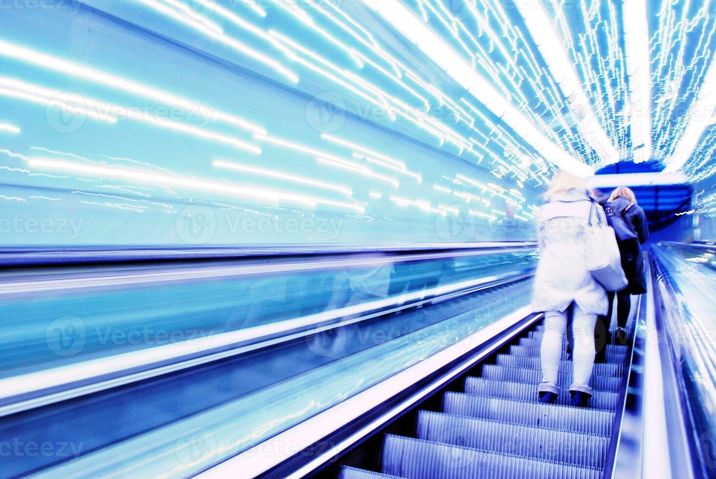 Blurred backround of moving futuristic escalator. Blurred image.Post process in vintage style photo