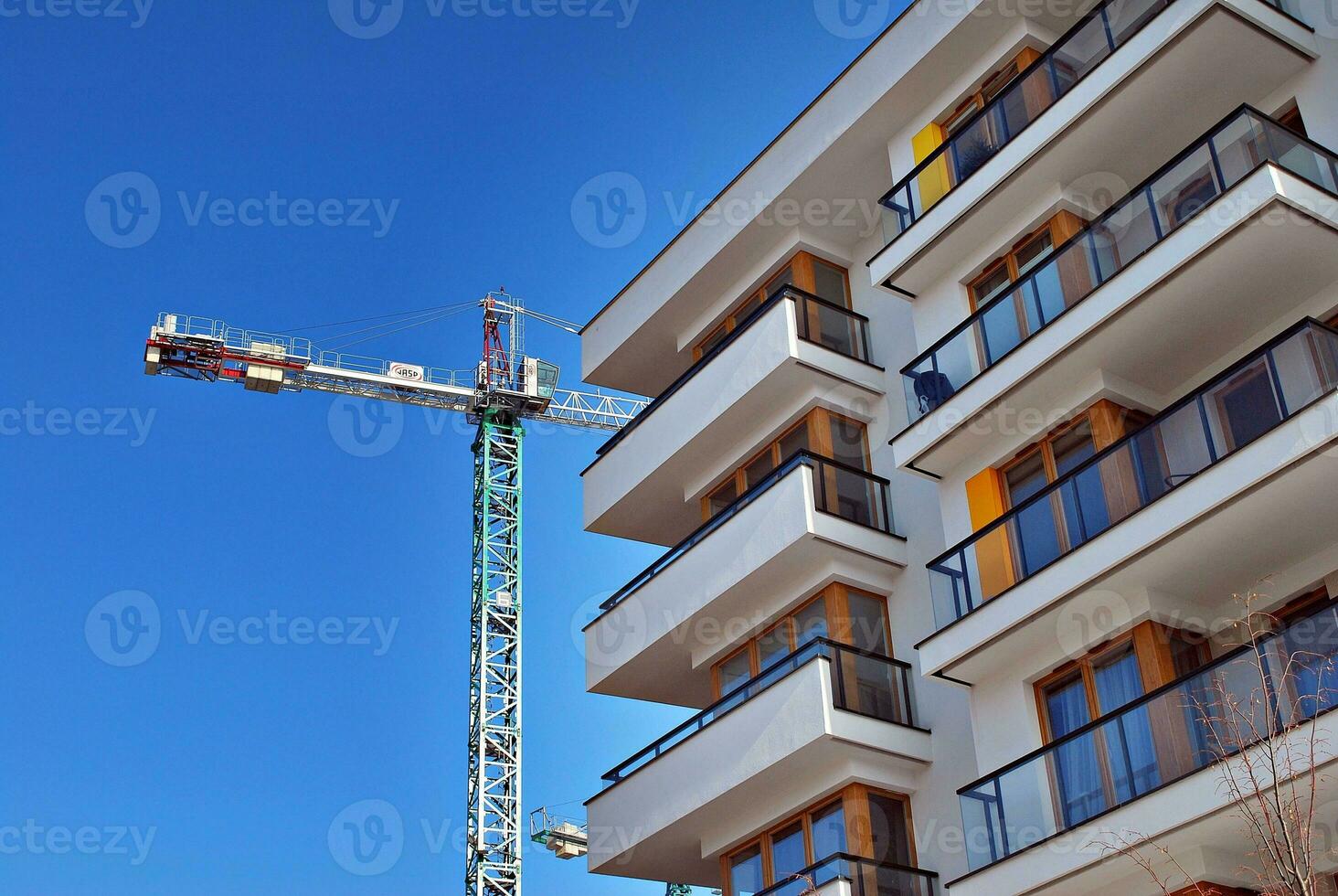Modern and new apartment building. Multistoried, modern, new and stylish living block of flats. photo
