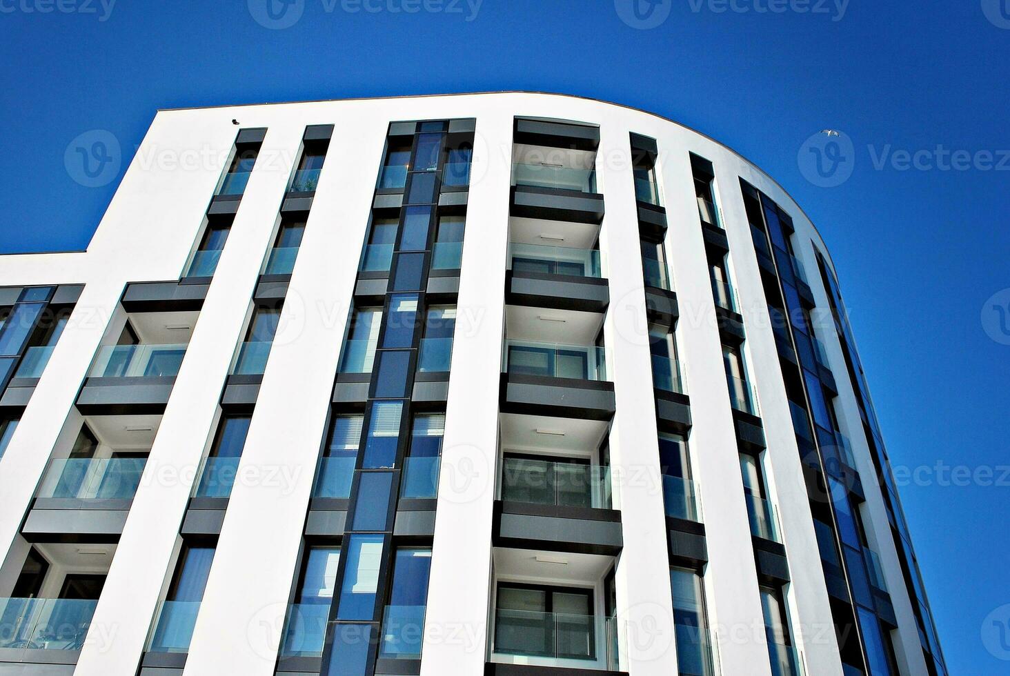 Modern and new apartment building. Multistoried, modern, new and stylish living block of flats. photo