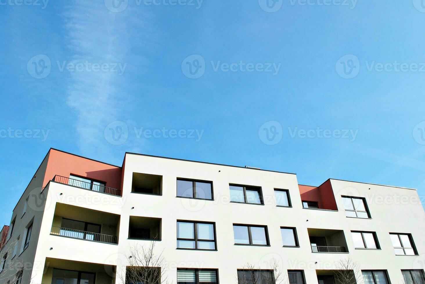 Modern and new apartment building. Multistoried, modern, new and stylish living block of flats. photo