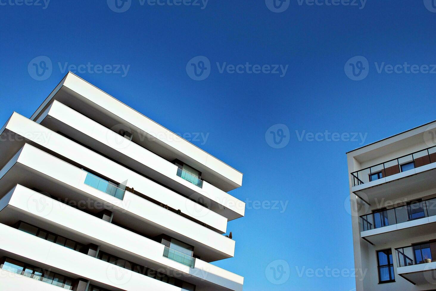 Modern and new apartment building. Multistoried, modern, new and stylish living block of flats. photo