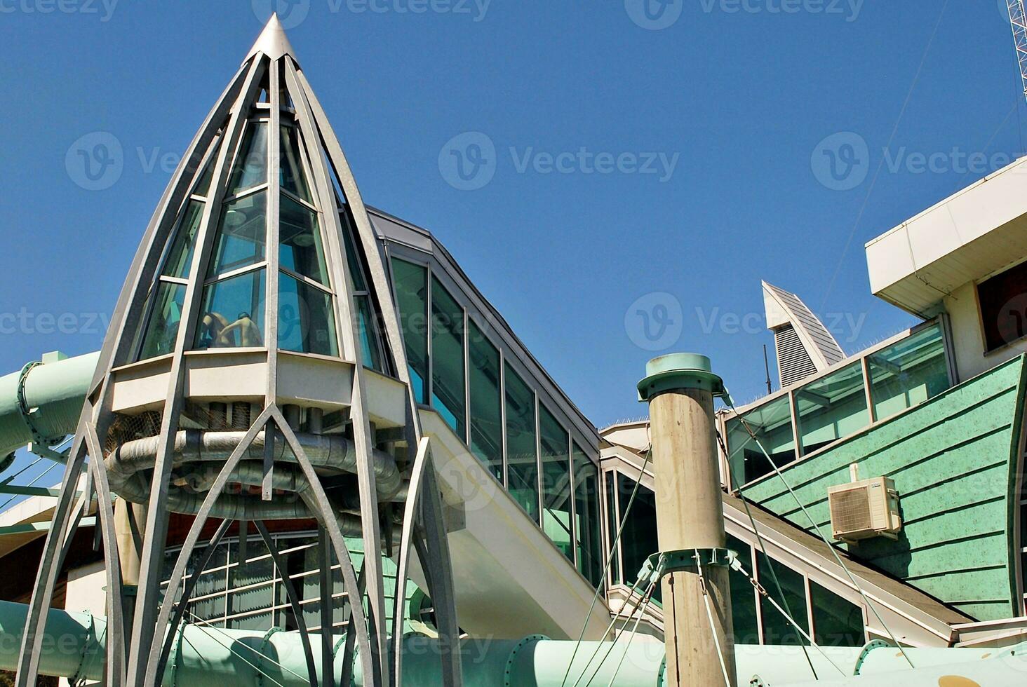 Modern building glass roof metal frame construction. Metal structure supporting glass roof. photo