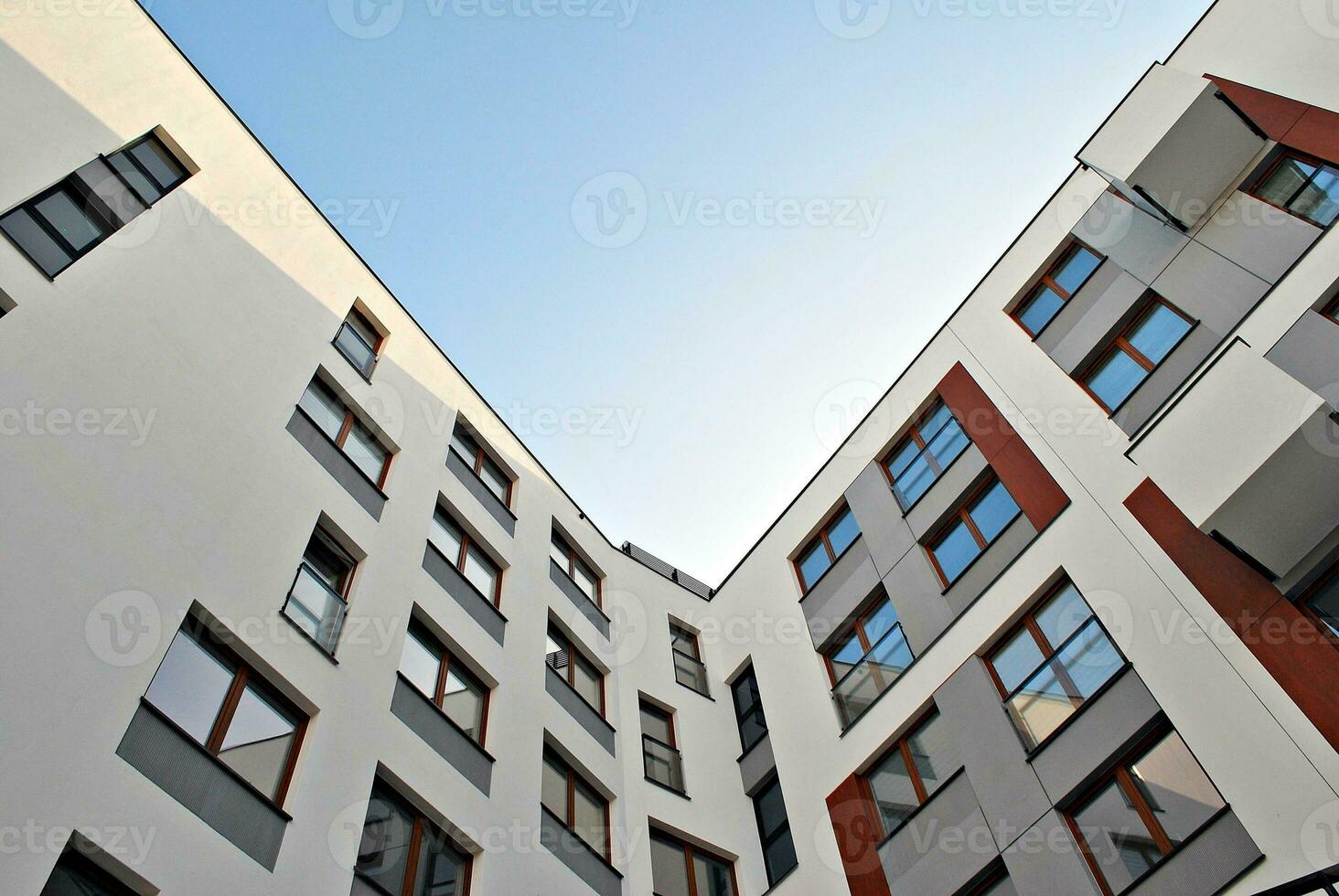 Modern and new apartment building. Multistoried, modern, new and stylish living block of flats. photo