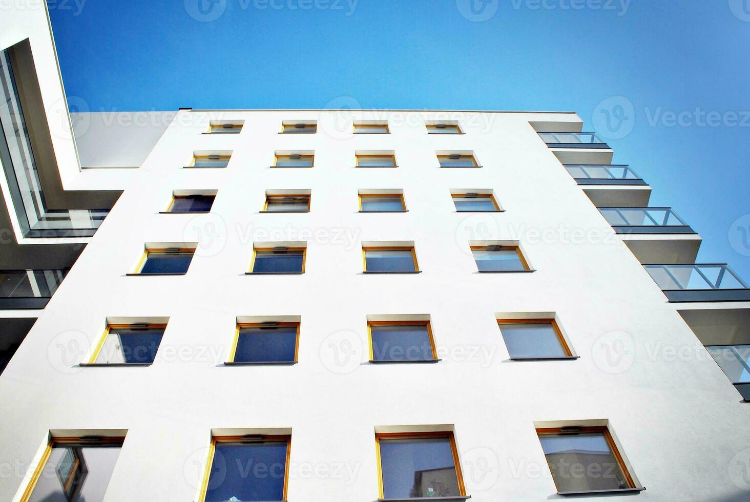 Modern and new apartment building. Multistoried, modern, new and stylish living block of flats. photo