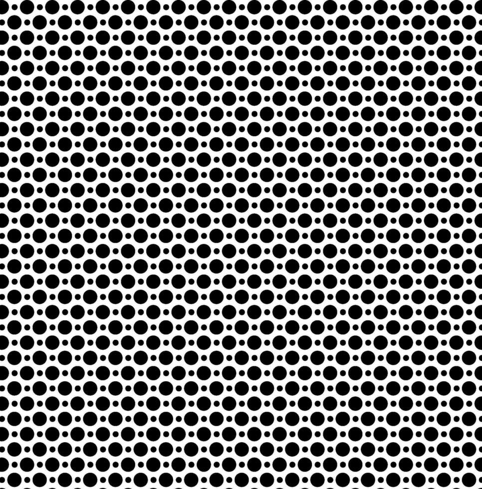 Seamless vector texture in the form of small and large black polka dots on a white background