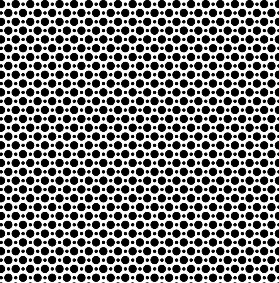 Seamless vector texture in the form of small and large black polka dots on a white background