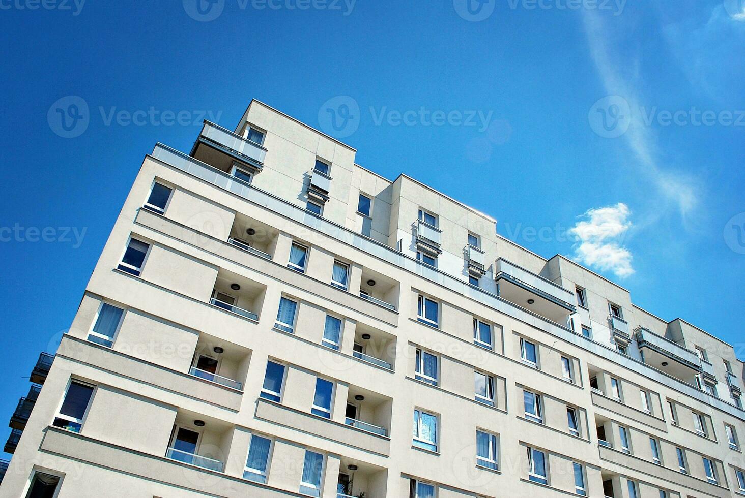 Modern and new apartment building. Multistoried, modern, new and stylish living block of flats. photo