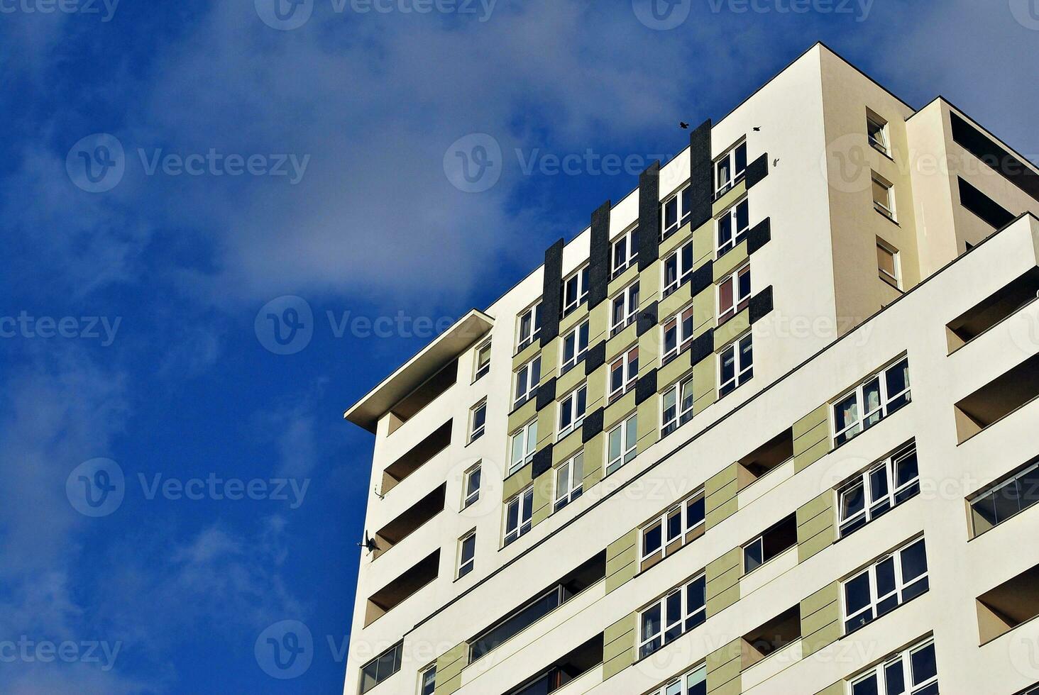 Modern and new apartment building. Multistoried, modern, new and stylish living block of flats. photo