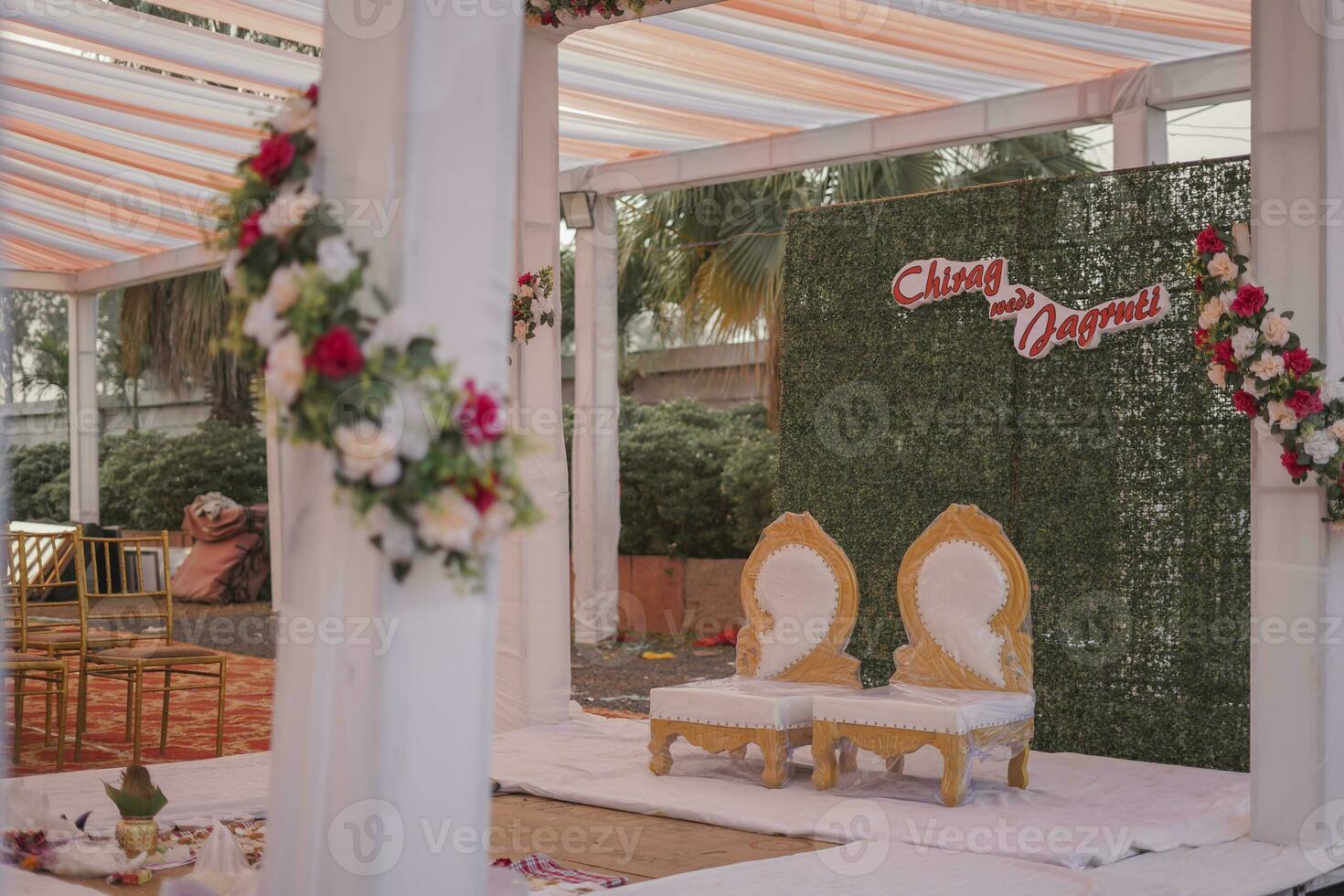 Wedding Stage Decoration A stunning wedding stage decorated with two chairs photo