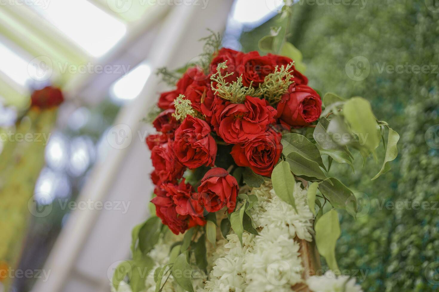 Bouquet of red artificial flower in Indian wedding photo